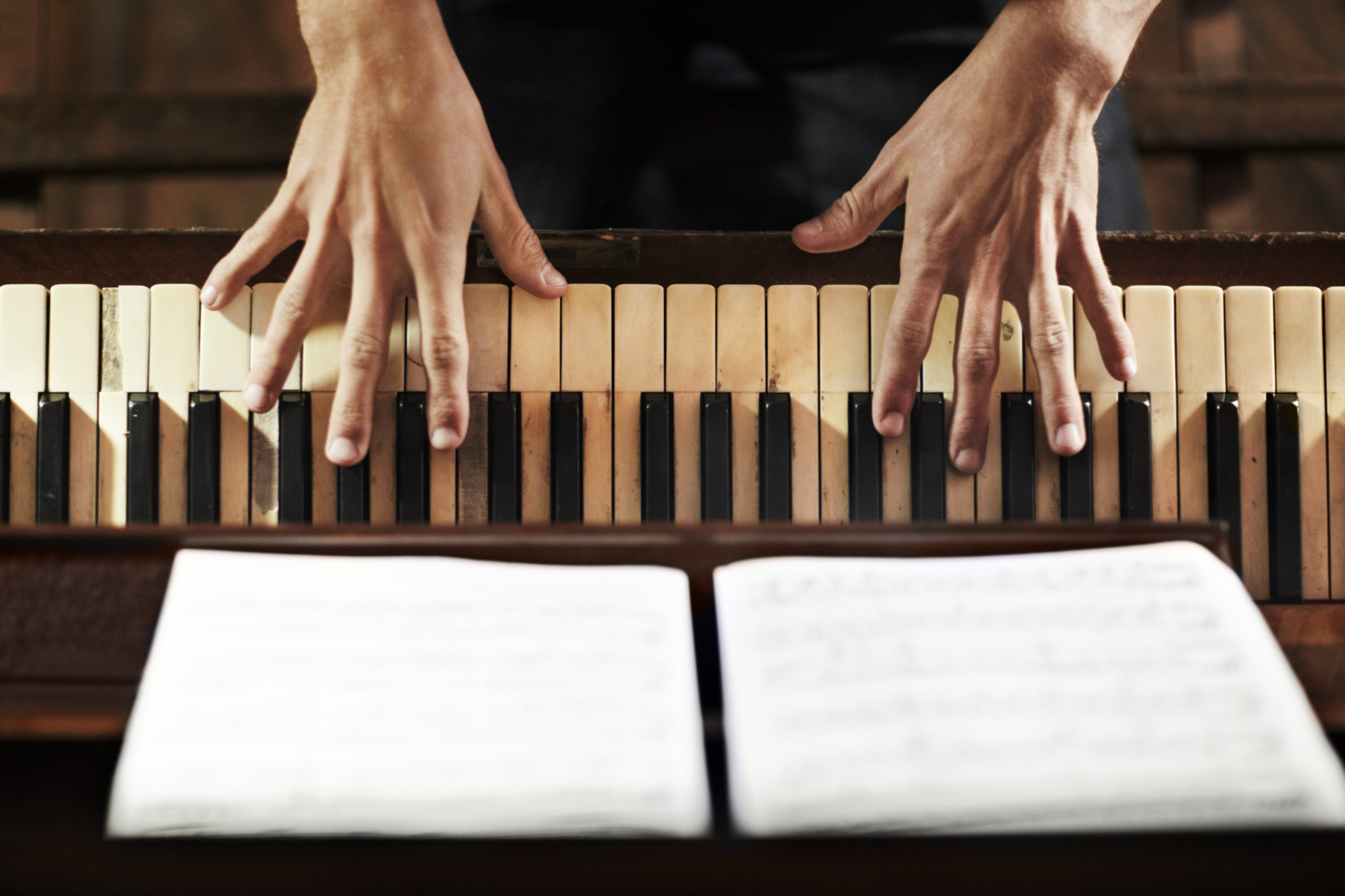 Cropped high-angle view of a pianist's hands