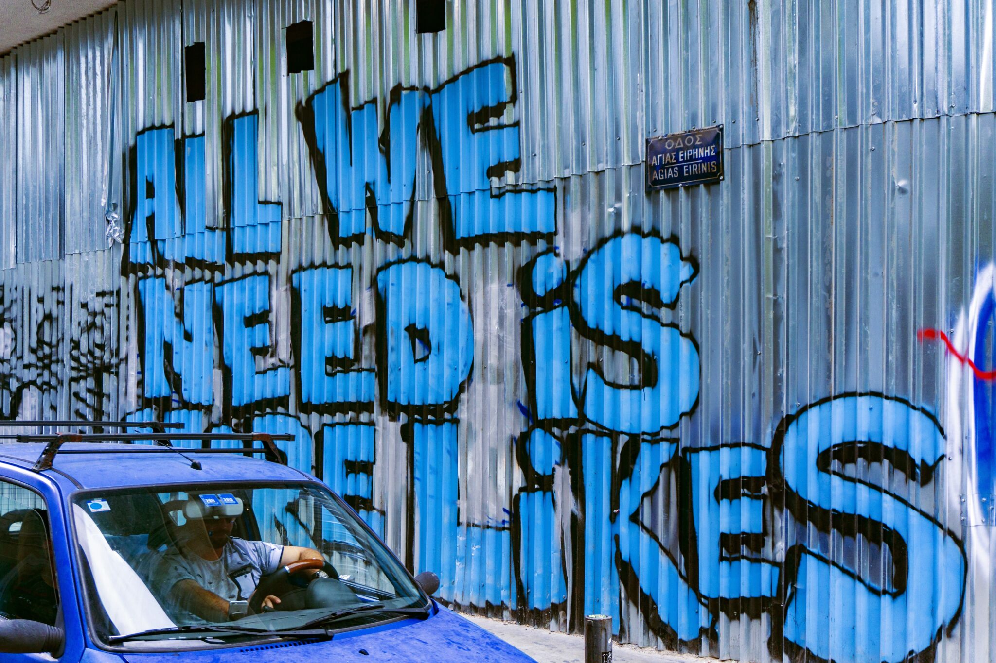 Graffito "ALL WE NEED IS MORE LIKES"