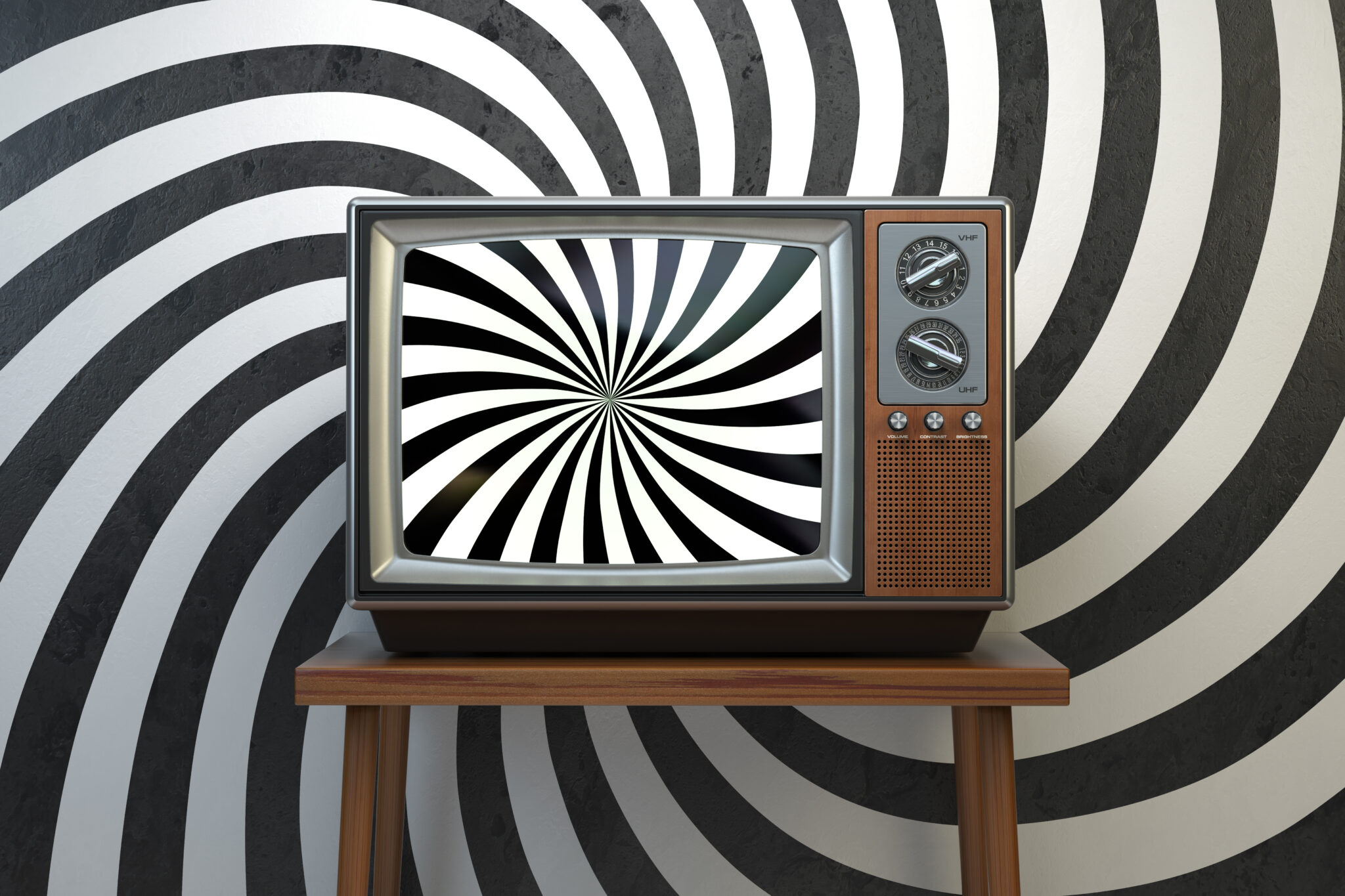 Ein Retro-Fernseher im hölzernen Rahmen mit schwarzweiss-hypnotischer Spirale im Bild und drumherum.